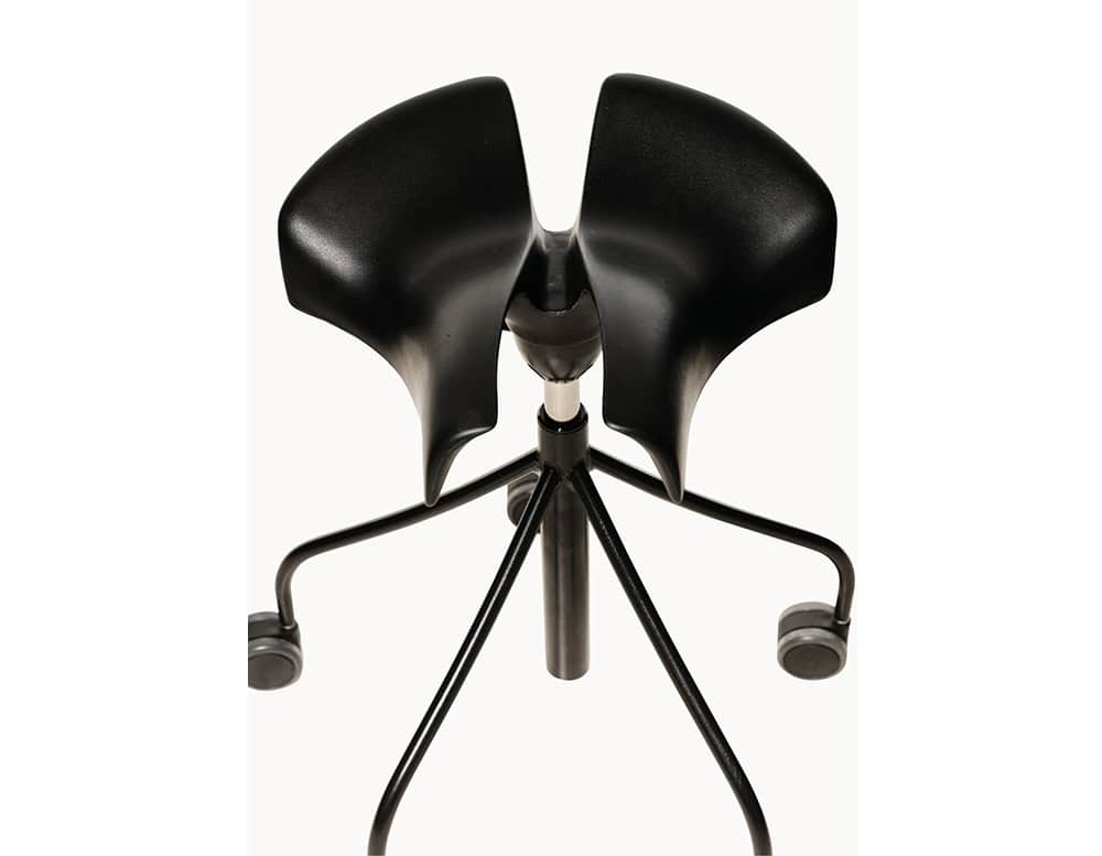 The BD Binaria Stool in black features a distinctive ergonomic saddle seat and a sleek five-legged wheeled base, providing both mobility and contemporary style.