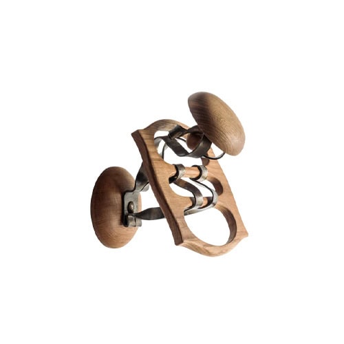 The BD Calvet Hanger combines natural oak with hand-forged iron, creating a dynamic silhouette with fluid curves and rounded wooden forms.