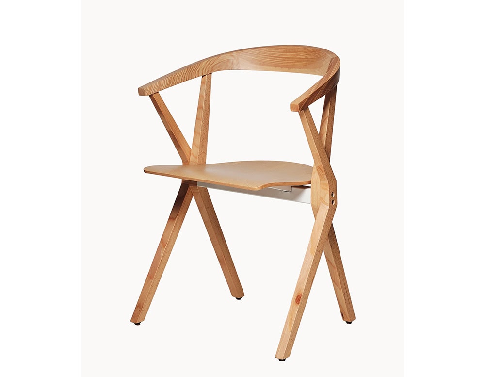 Side view of the BD Chair B, showcasing its natural wood construction, curved backrest, and geometric leg structure. A lightweight wooden chair with a foldable seat and elegant design.