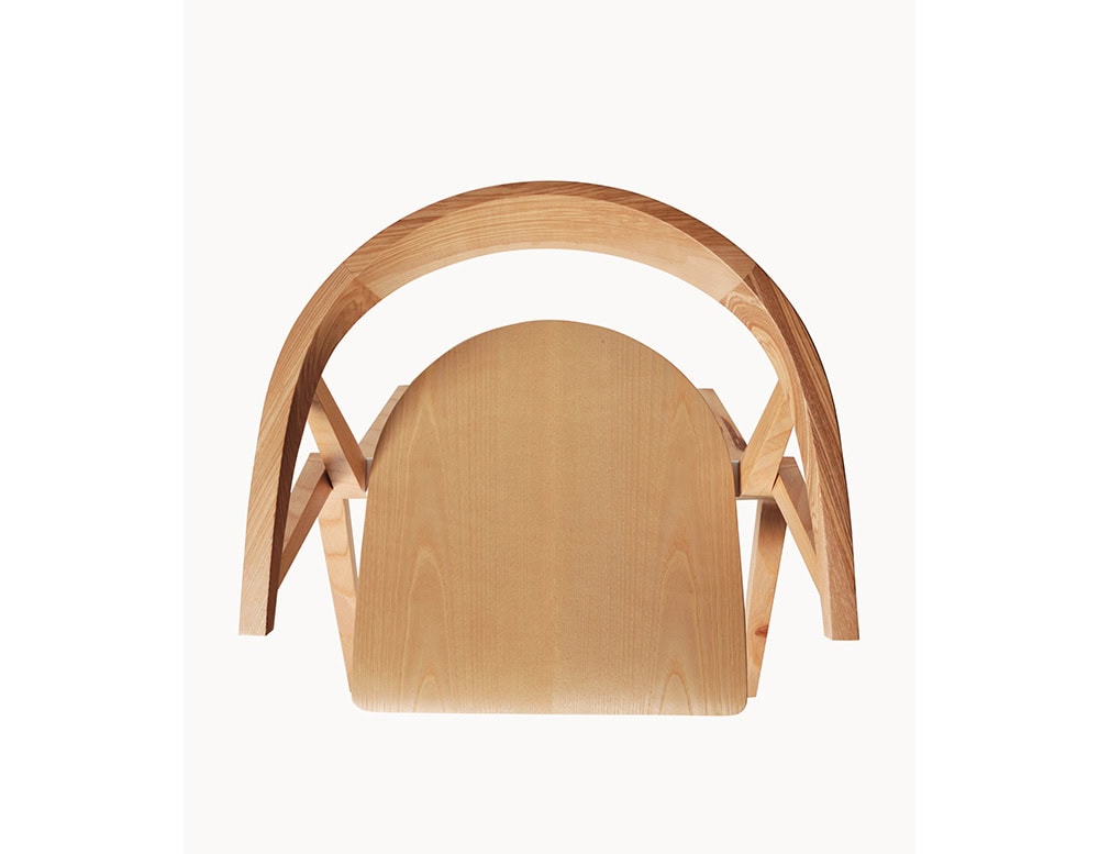 Top view of the BD Chair B in natural wood, highlighting its curved backrest, folded seat, and sleek, compact form.