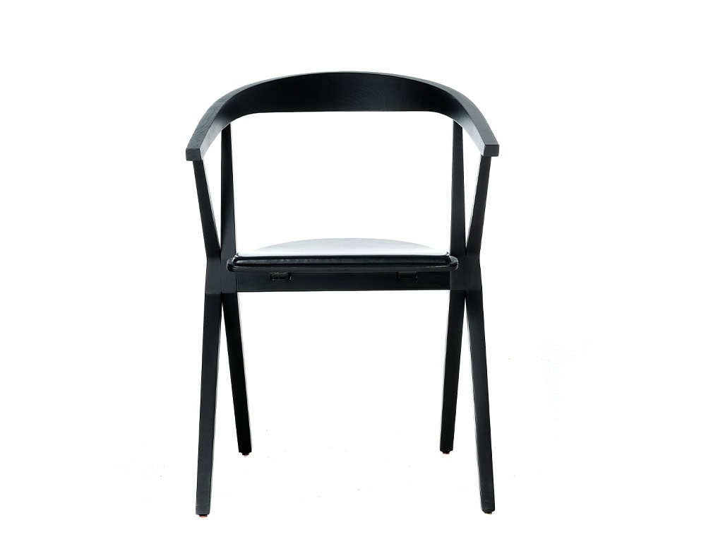 A front view of the BD Chair B reveals its curved backrest and simple, folding mechanism designed for comfort and practicality.