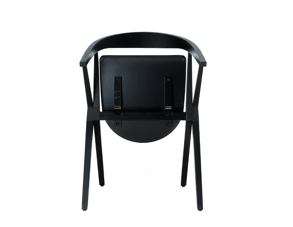 This view highlights the BD Chair B's rear profile, focusing on its folding mechanism. The design combines clean geometry with practical functionality.