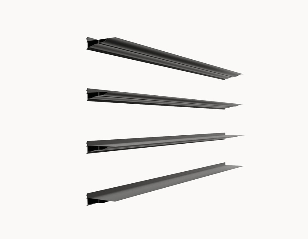 Set of BD Cornisa Shelves in matte black, shown from a side angle to highlight the elegant cornice-inspired profiles and the modular design that allows flexible arrangement on the wall.