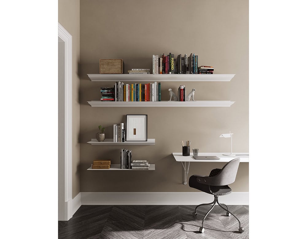 The BD Cornisa Shelf system creates a clean, minimalist arrangement on the wall, blending functionality and design. The staggered shelves showcase a curated mix of books, decorative items, and personal accents, enhancing the space with character.