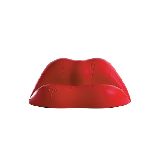 The Dalilips Sofa in a front-facing view, showcasing its bold lip-shaped form and sculptural surface details, with subtle impressions that enhance the surreal character of the piece.