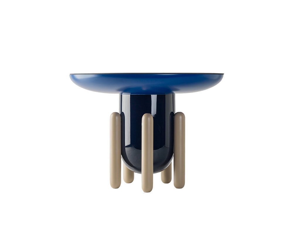 A bold side table with a glossy navy top and base, supported by multiple cylindrical taupe legs. The playful composition adds a sculptural, architectural touch.