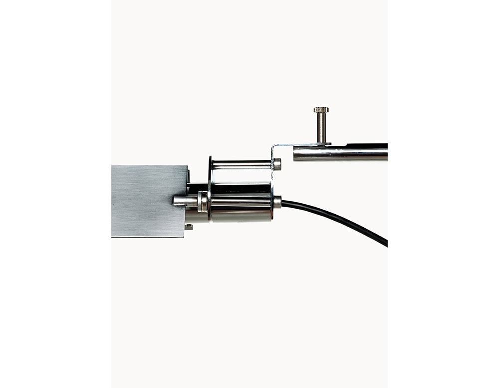 Side view of the BD Flamingo Floor Lamp, featuring polished metal hardware, a cylindrical light housing, and an adjustable pivot for precise light direction.