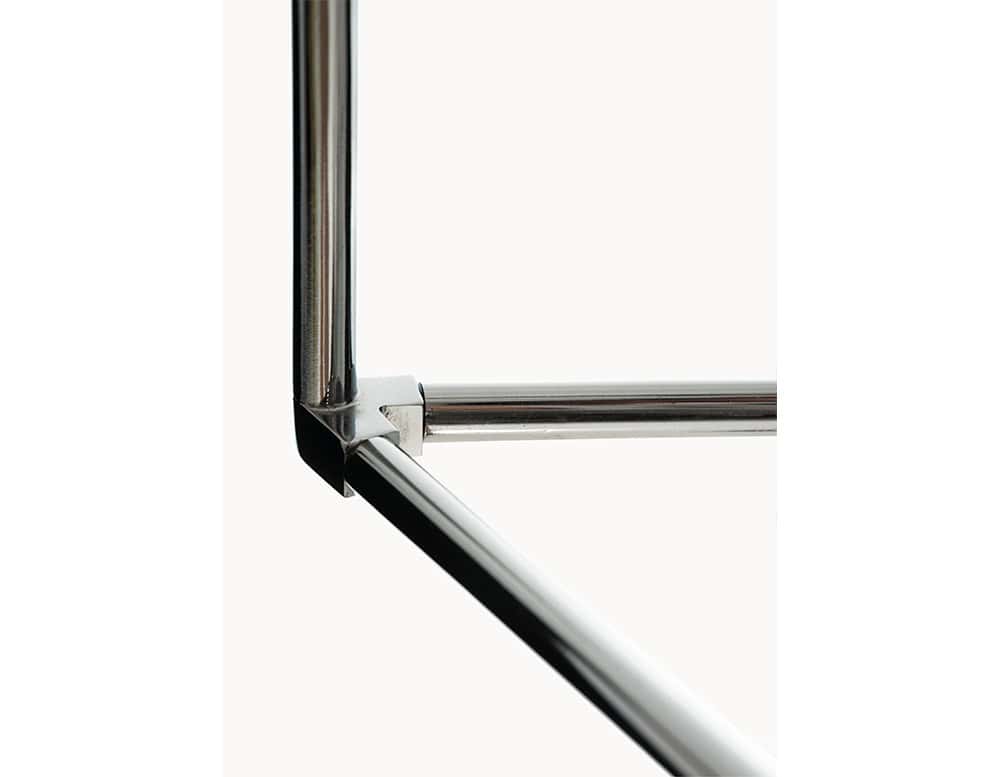 This close-up captures the base of the BD Flamingo Floor Lamp, highlighting its polished metal structure. The sleek tubular frame is joined with precision, showcasing minimalist lines and a refined, industrial-inspired aesthetic.