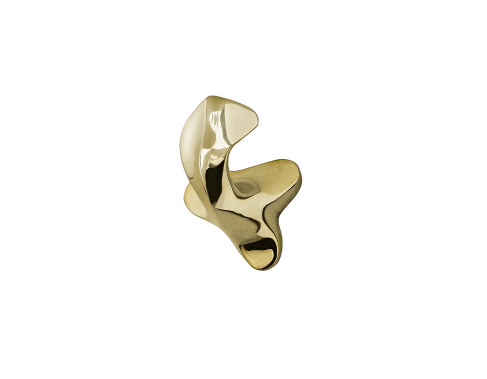 A Gaudí Door Knob in polished brass, featuring an organic, curved form with a soft reflective surface and fluid lines.