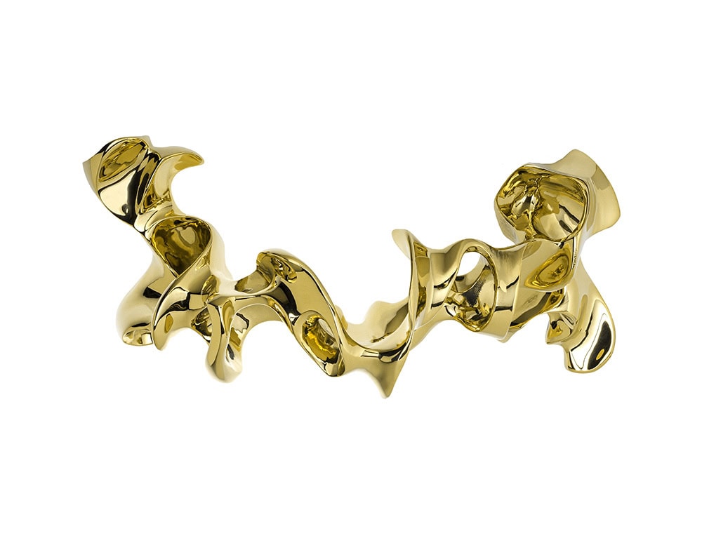 A Gaudí Door Knob in polished brass, shaped as an intricate, flowing handle with sculptural curves and smooth surfaces.
