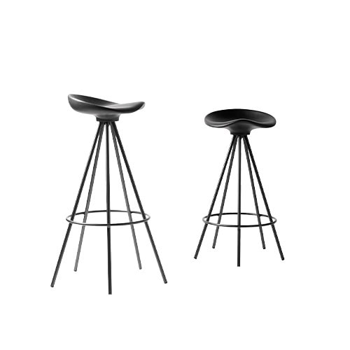 Two Jamaica Stools in black with sculpted seats and flared legs, one taller and one shorter. Their sleek design combines comfort and style, ideal for modern bar or counter settings.