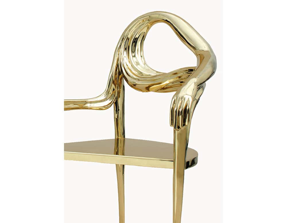 The BD Leda Armchair transforms bronze into a surreal silhouette. The design features fluid lines, an armrest shaped like a resting arm, and slender legs, blending function with poetic form.