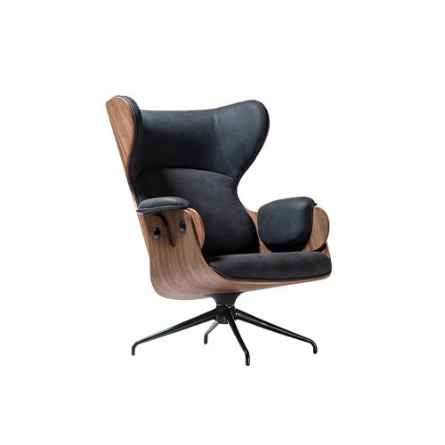 Lounger Armchair featuring black leather upholstery and curved walnut shell. Sculpted silhouette and plush cushions deliver comfort. Matte black swivel base enhances its refined, modern character.