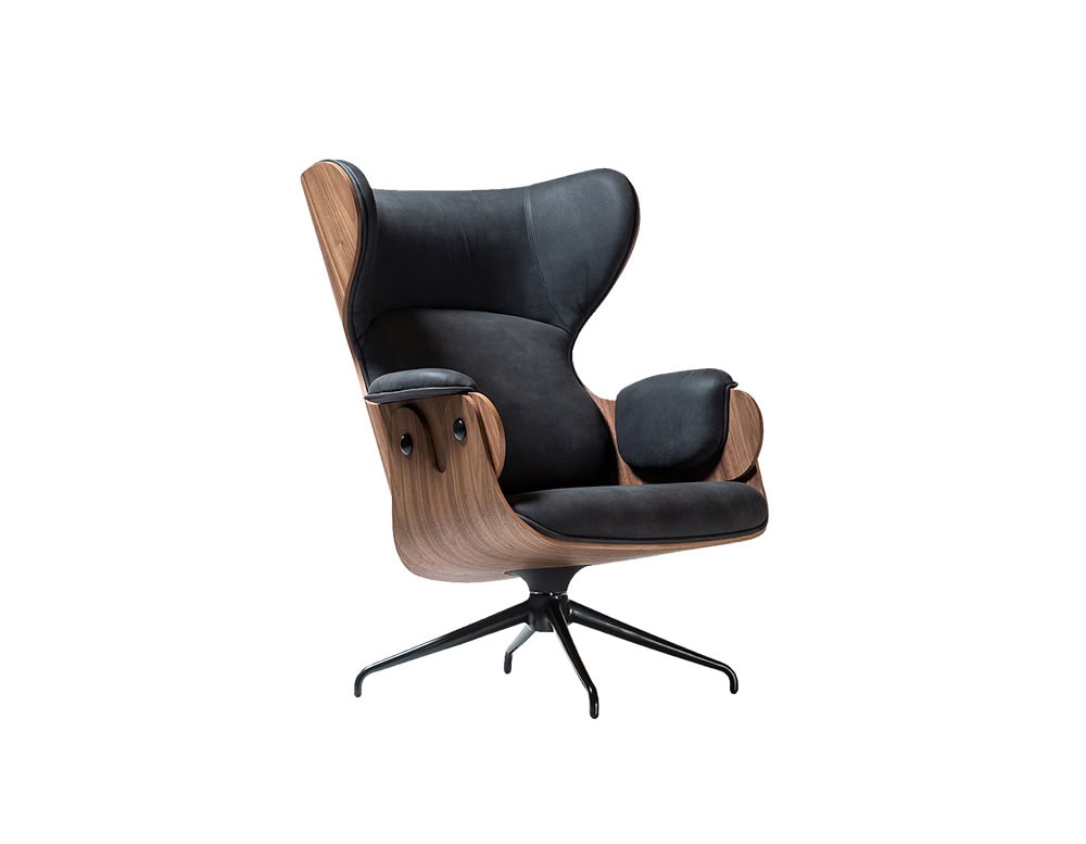 Lounger Armchair in deep black leather with sculptural walnut shell. Contrasting tones highlight the elegant curves. Black swivel base adds a sleek touch. Bold design meets everyday comfort.