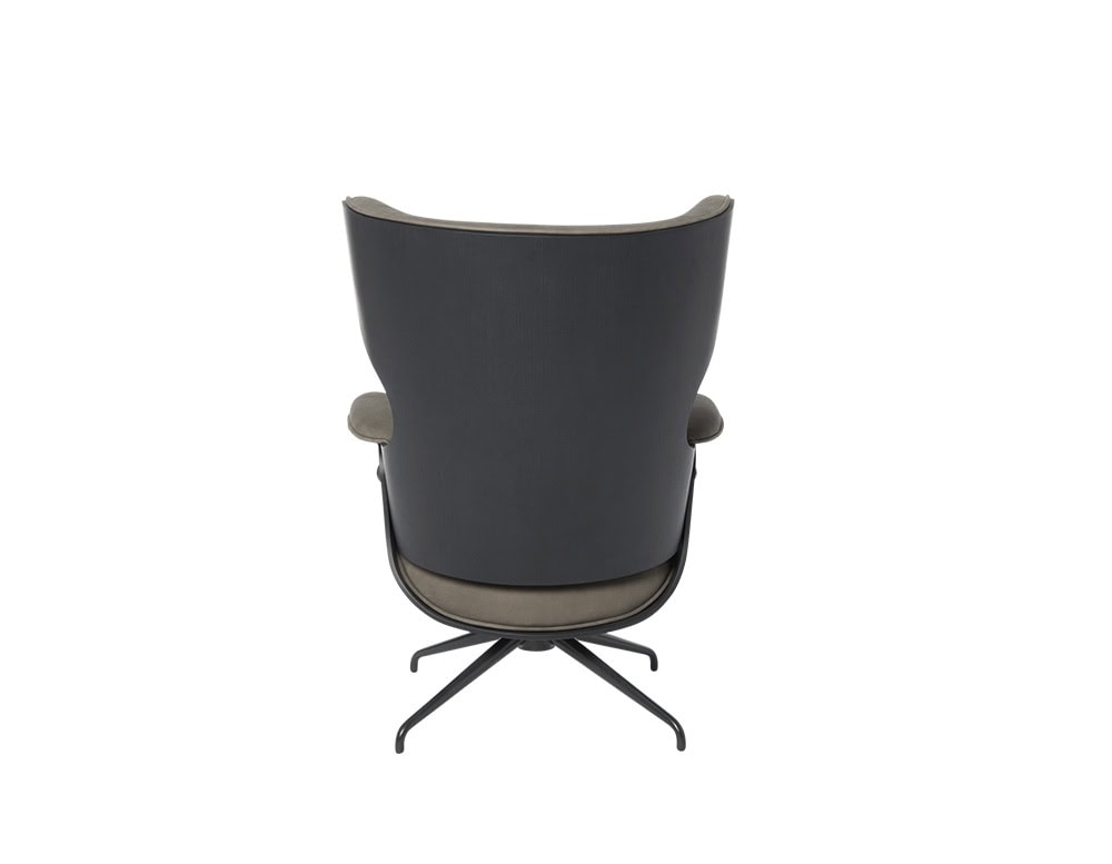 Rear view of the Lounger Armchair in black-stained ash with taupe leather. Features sculptural curves, integrated armrests, and a four-star swivel base. The design highlights craftsmanship and comfort from every angle.