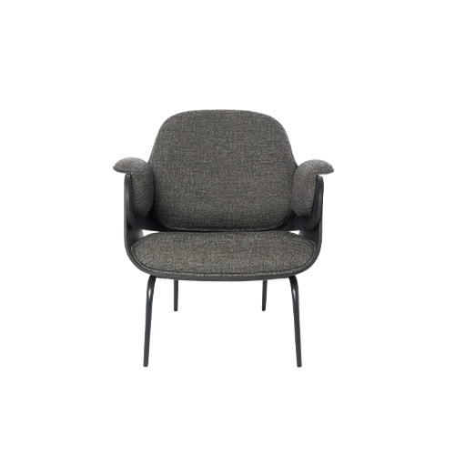 An inviting lounge chair with generous, curved cushions in soft grey fabric. The armrests are padded and slightly elevated, adding comfort and a playful touch to the chair’s clean-lined black frame.