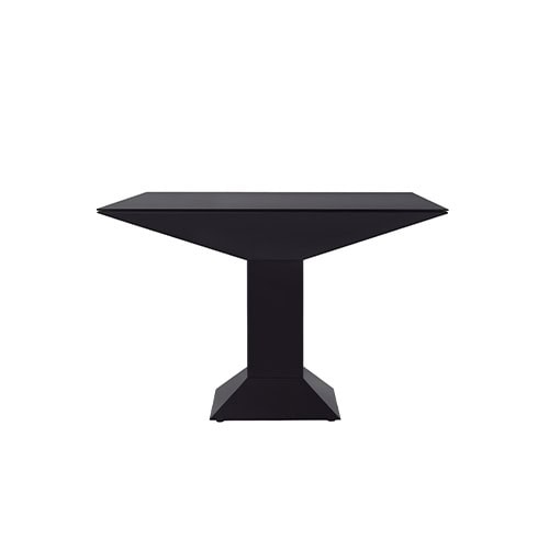 Mettsass Table in matte black lacquer finish with angular pedestal base and beveled square top, offering a sculptural and modern silhouette.