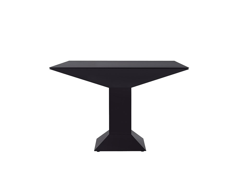 Mettsass Table in matte black lacquer with geometric pedestal base and beveled square top, showcasing a bold and minimalist design.