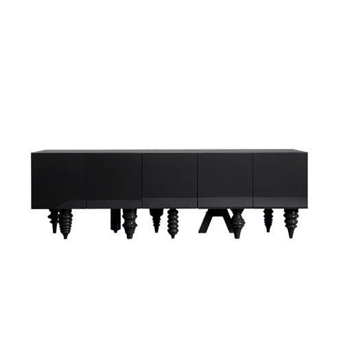 A matte black cabinet defined by its clean and minimal silhouette. The piece is supported by an eclectic set of sculptural legs in various forms, introducing a playful element that contrasts with the cabinet's understated body.