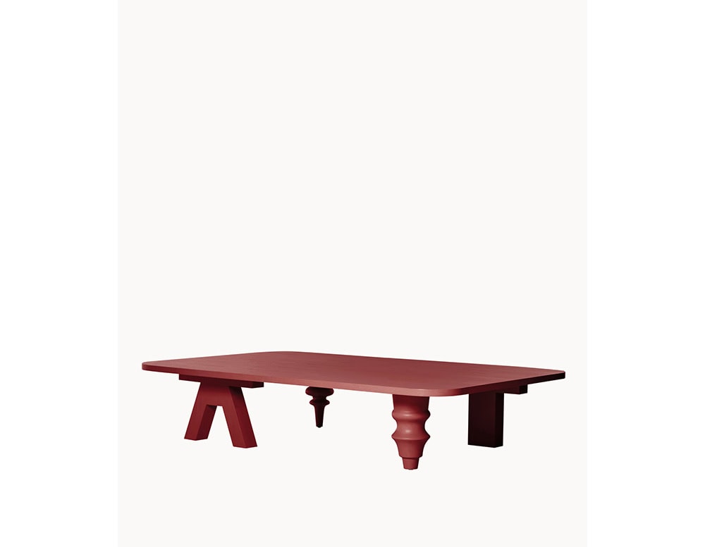 Multileg Coffee Table in matte terracotta red with eclectic mix of leg designs, creating an artistic and playful visual contrast under a rectangular top.
