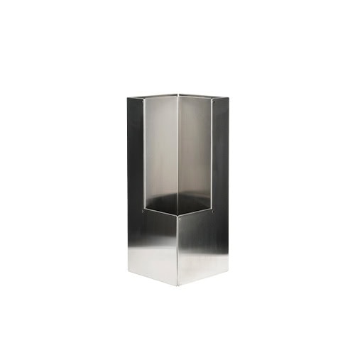 A stainless steel umbrella stand with a sculptural pleated design, featuring clean lines and a minimalist geometric form.