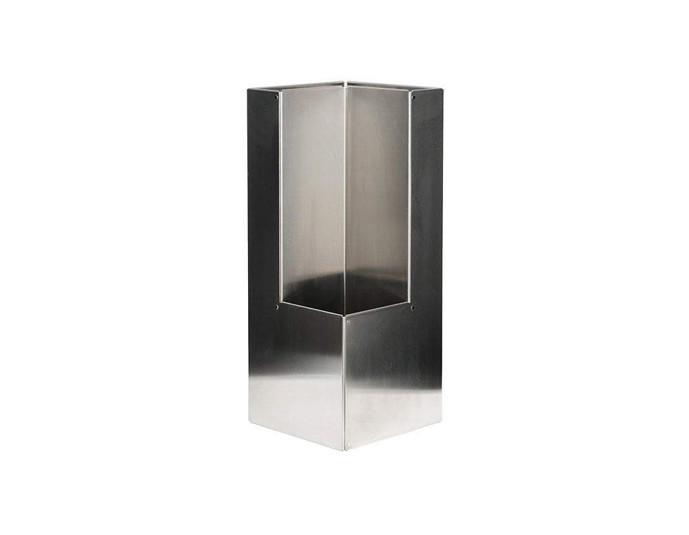 A geometric metal umbrella stand with pleated folds, crafted from polished stainless steel with a reflective finish and sharp linear cuts.