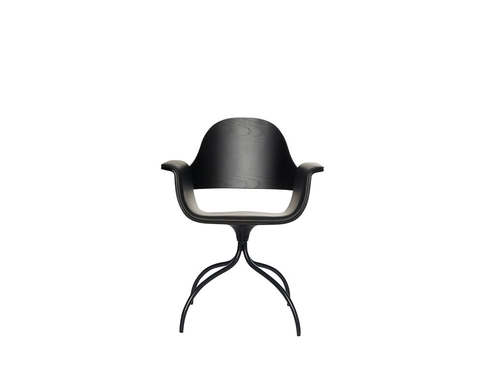 Curved wood chair in deep black finish with flared arms and a smooth contoured back, supported by a spider-like metal base in matte black.