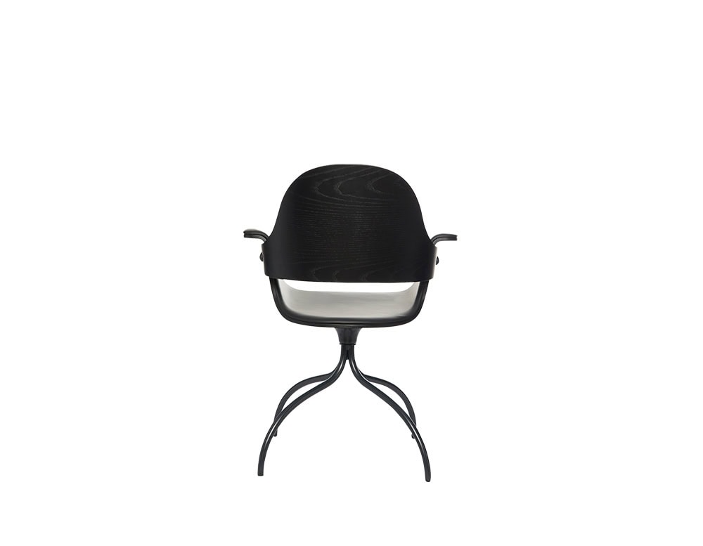Sculptural chair with a smooth black wood backrest, curved armrests, and a contoured white seat, supported by elegant, branching metal legs for a striking silhouette.