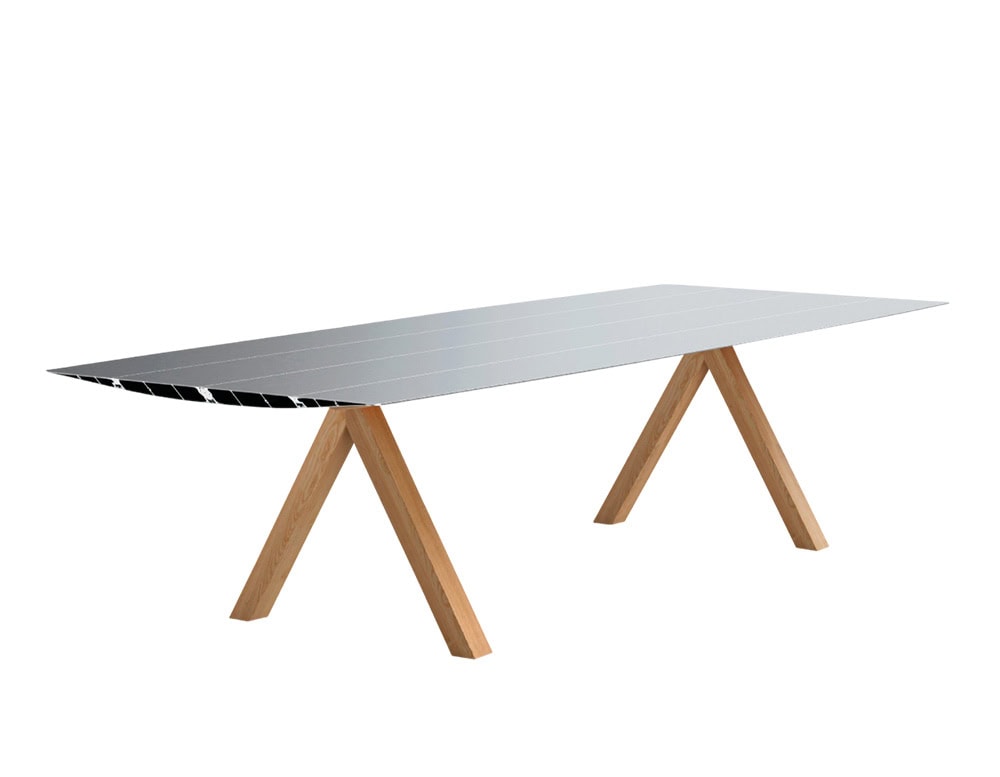 The BD Table B features a slim aluminum tabletop with precision-cut edges. Its angled wooden legs create a warm contrast, balancing industrial and natural materials in a minimalist silhouette.