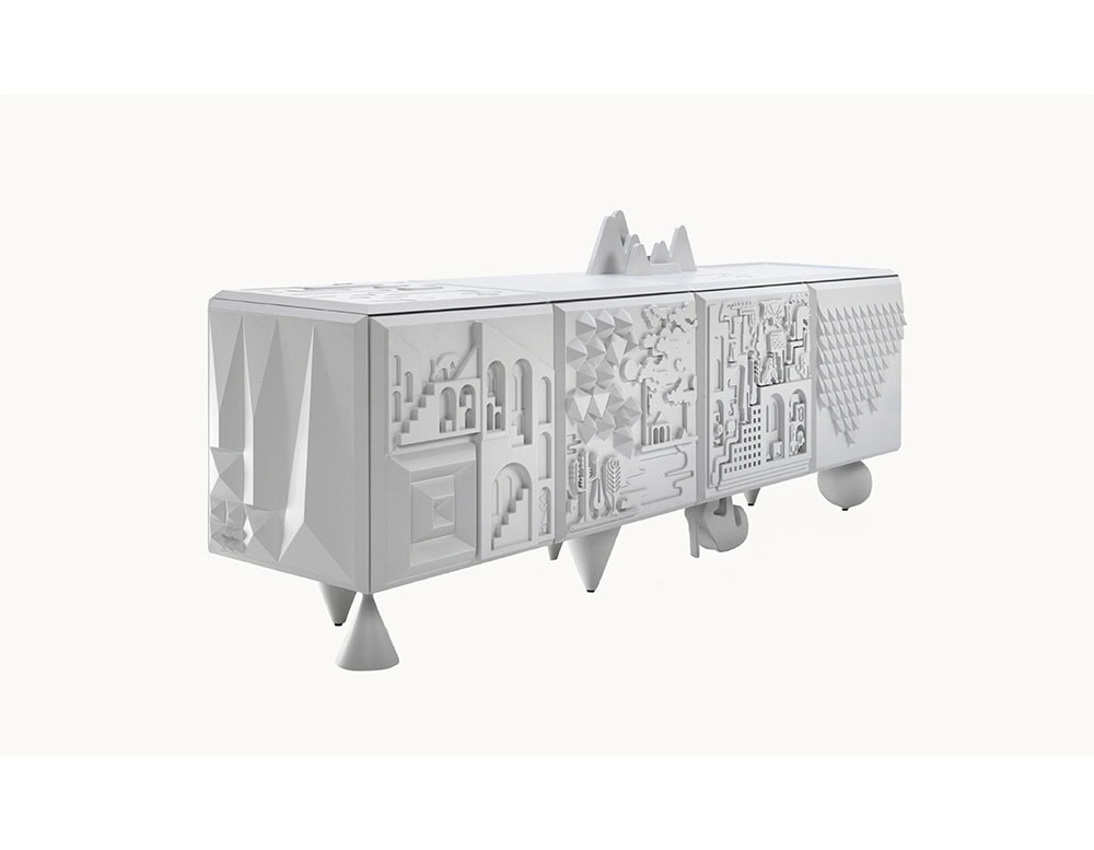 White cabinet with intricate reliefs on each panel, featuring abstract architecture, foliage, and geometric patterns. Its playful sculptural legs include conical, spherical, and stylized high-heel shapes.