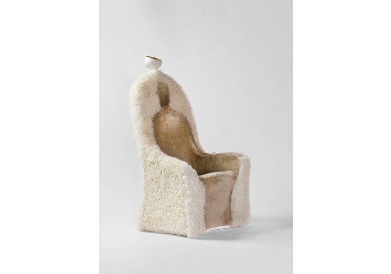 armchair made of sheepskin in the shape of a human silhouette in a white tone