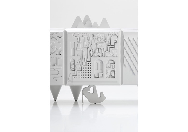 shelf made of a wooden base with a particular design in shades of white, figurine design engraved on its body