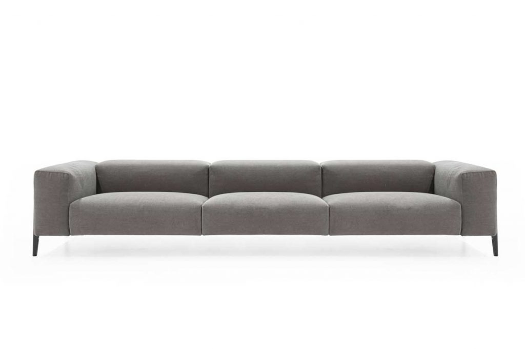 sofa made of wood and completely upholstered in gray fabric