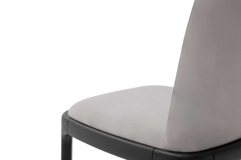 chair made of gray fabric and black wooden base