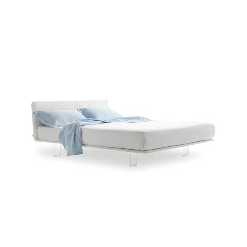 bed made with a cirstal base and upholstered in white leather on its back and white fabric