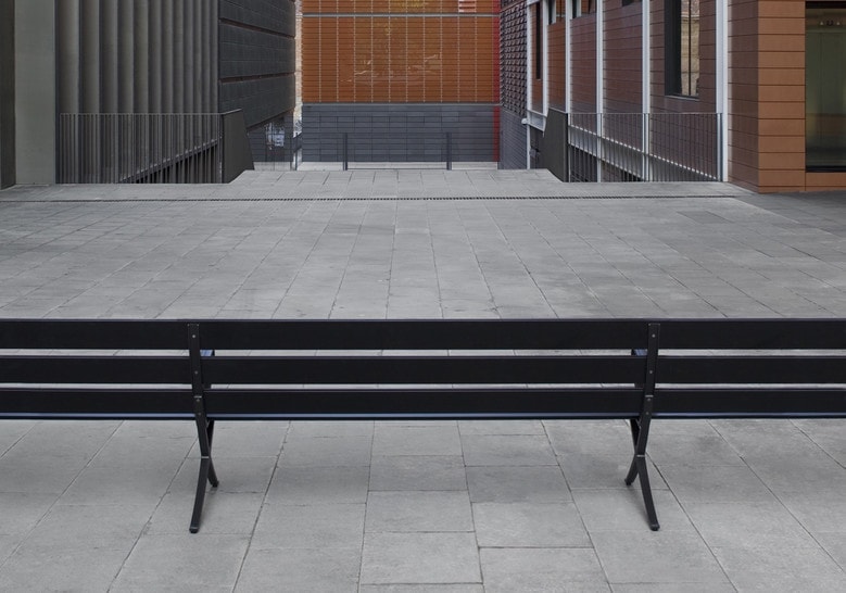 bench made of three planks in steel in a shiny black tone