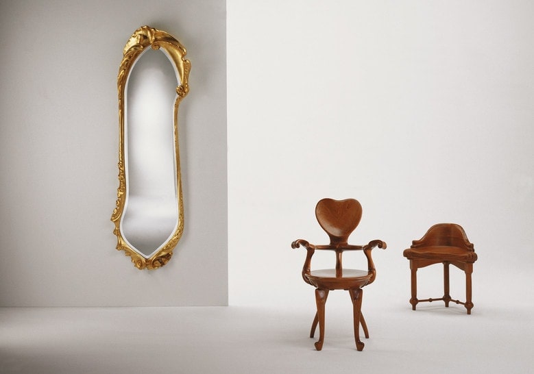 wall mirror made of oak wood covered in gold leaves on a white background