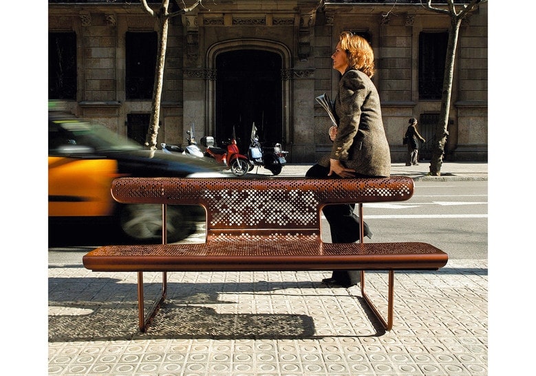 bench with table made of steel tube base and seats made of steel plated in a bronze color tone