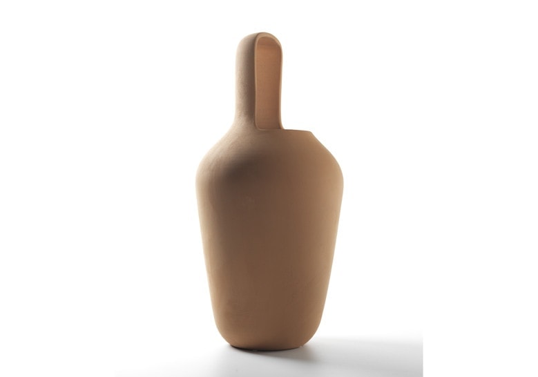 vase with opening in the middle made of terracotta base in an orange color on a white background