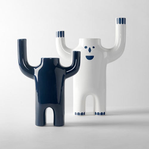 two jetti-shaped vases made of ceramic base in an axul and white color tone