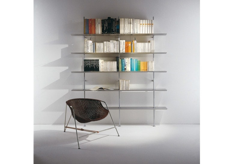 shelf with several vertical supports in a silver color tone on a gray background