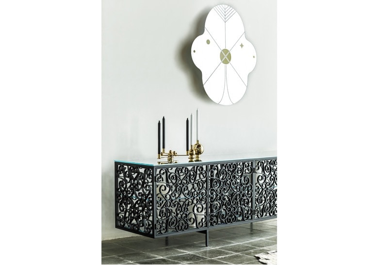 mirror made of two oval-shaped panels in a black and gold tone