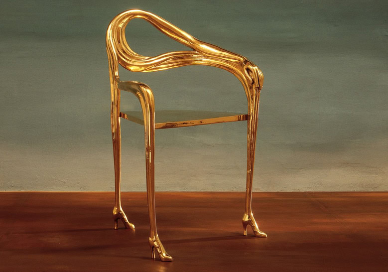 chair made of varnish base on its legs designed with heels and golden brass on its structure