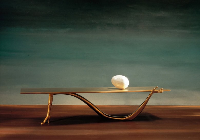 sculpture made in the form of human arms on a marble base in a golden tone and white finishes