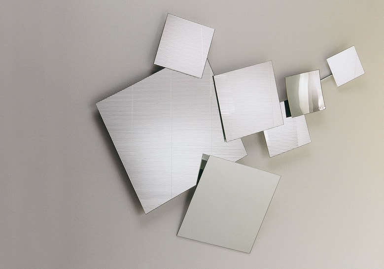 Mirror composed of 7 square panels of different sizes in a silver tone