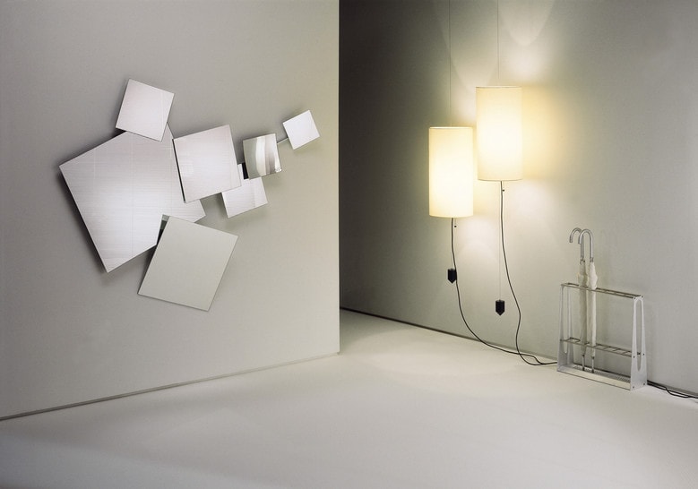 large mirror made of thick glass composed of 7 parts of different sizes in a silver tone