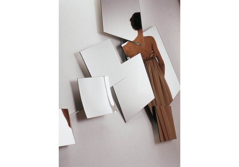 large mirror made of thick glass composed of 7 parts of different sizes in a silver tone