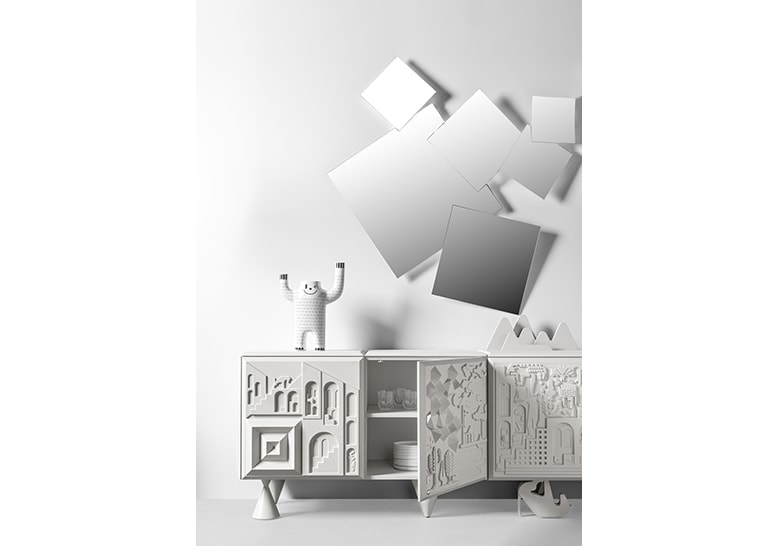 mirror made of 7 square-shaped mirror parts in a gray tone on a white background