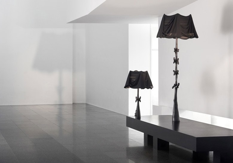 two lamps made of wood throughout its structure dyed in a black tone