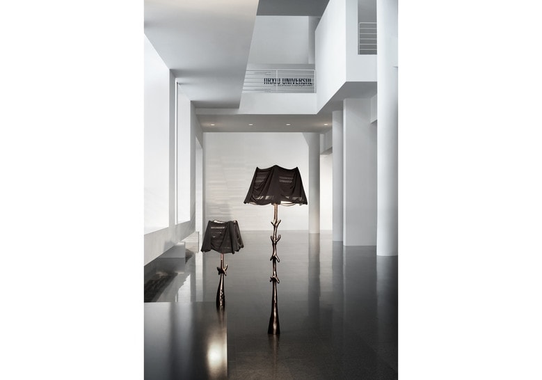 two lamps made of wood throughout its structure dyed in a black tone